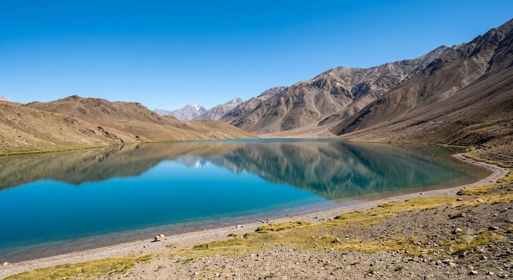 Chandratal Lake in Spiti Valley surrounded by bare mountains