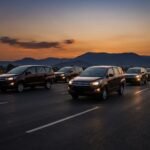 Innova Crysta taxi on a highway at dusk heading toward distant hills